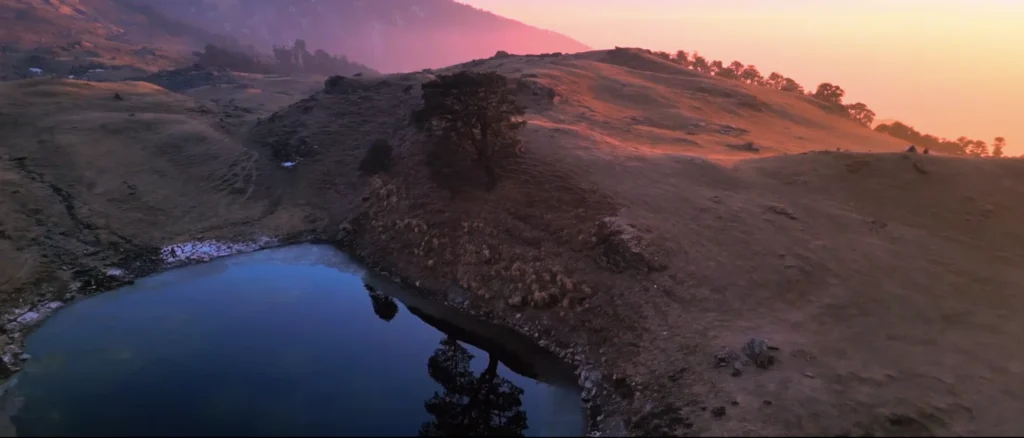 Brahmatal Lake sunrise view Uttarakhand, scenic alpine lake during Brahmatal Trek, Himalayan lake landscape India, Brahmatal winter trek mountain scenery, best Himalayan trekking destination