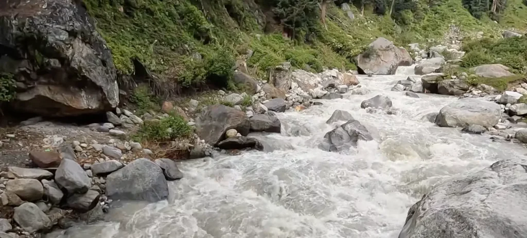 Jobra village glacier stream during Hampta Pass Trek near Manali with rocky Himalayan landscape and mountain river views